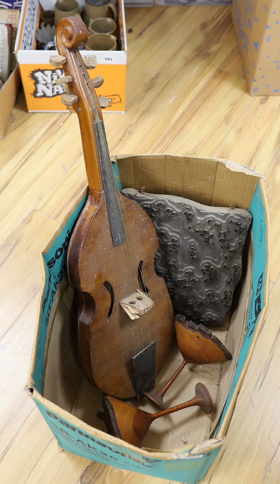 An Indian tile block, musical instrument etc